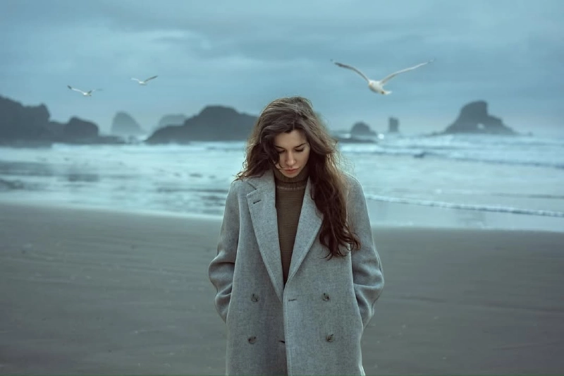 Moody Shoreline Portrait with Dramatic Backdrop