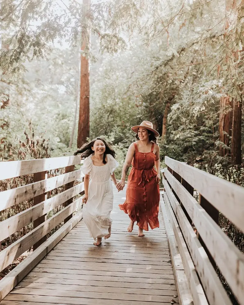 Mother-Daughter Joyful Walk Through the Forest