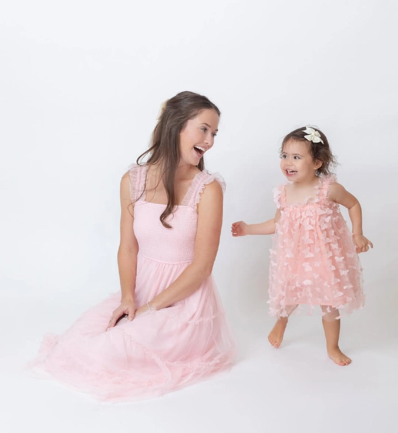 Playful Mother-Daughter Bond in Pink