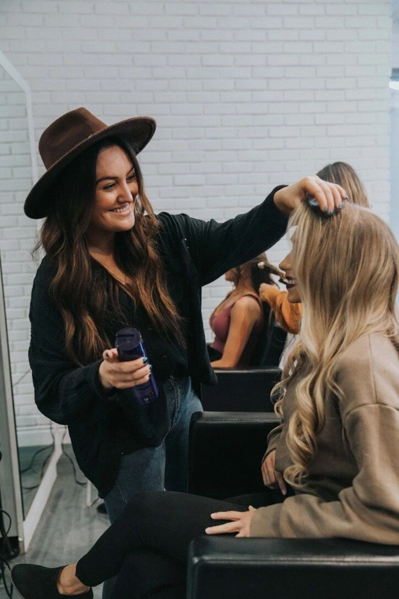 Salon Stylist Preparing a Client Photo Session
