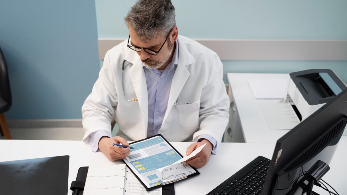 doctor filling document