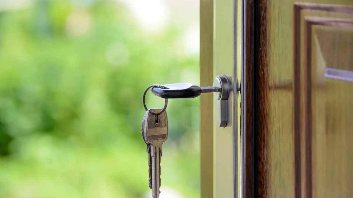 House key in the lock of a front door