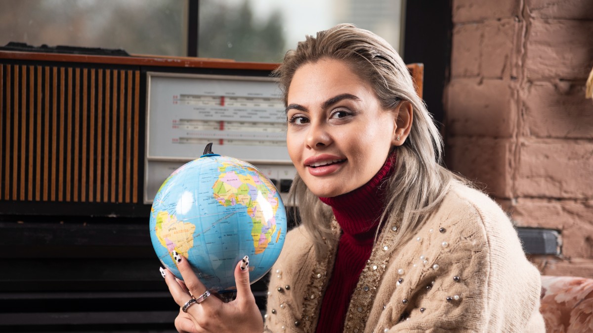 lady holding world globe